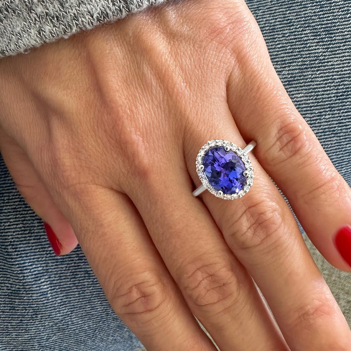 Elegant tanzanite and diamond ring featuring a captivating tanzanite center stone accented by sparkling diamonds for a timeless and sophisticated look.