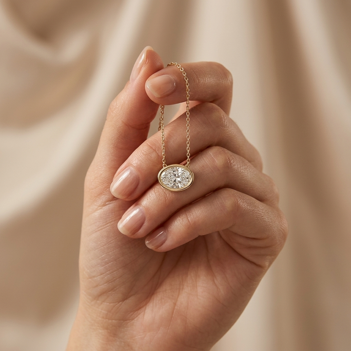 Beautiful oval-cut lab grown diamond bezel-set necklace, adding radiant sparkle to any occasion