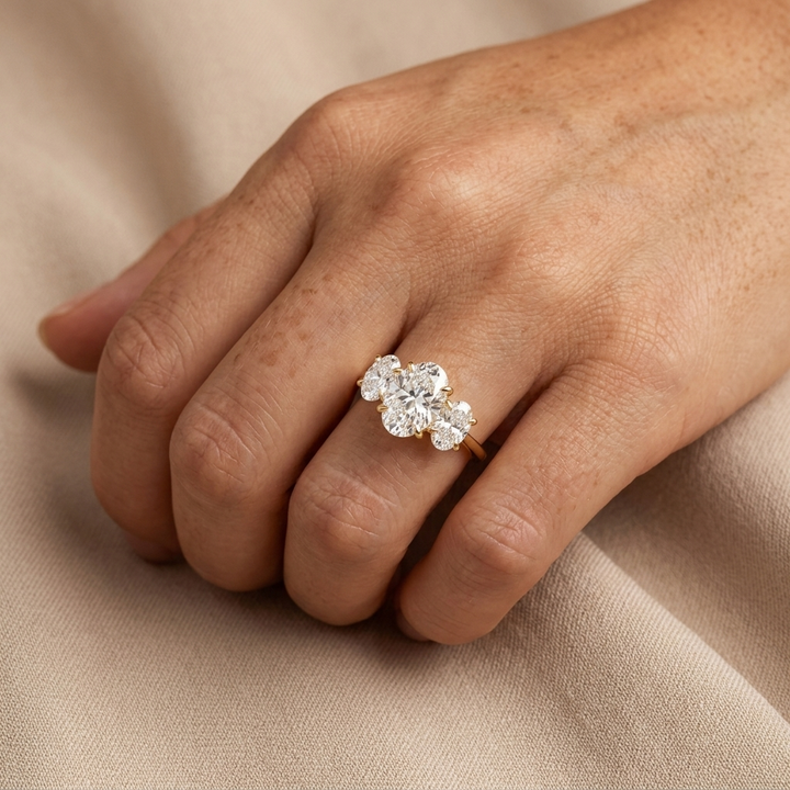 Three stone oval diamond engagement ring, detail view
