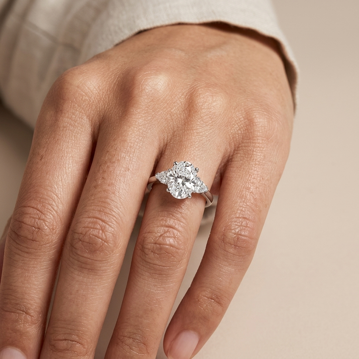 Oval and pear three stone engagement ring, alternate view