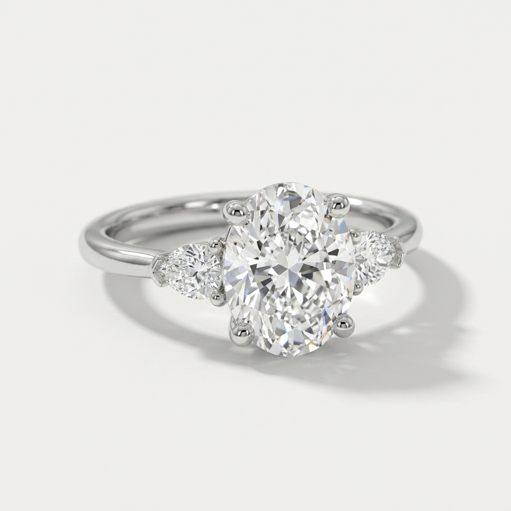 Oval and pear three stone engagement ring, detail view