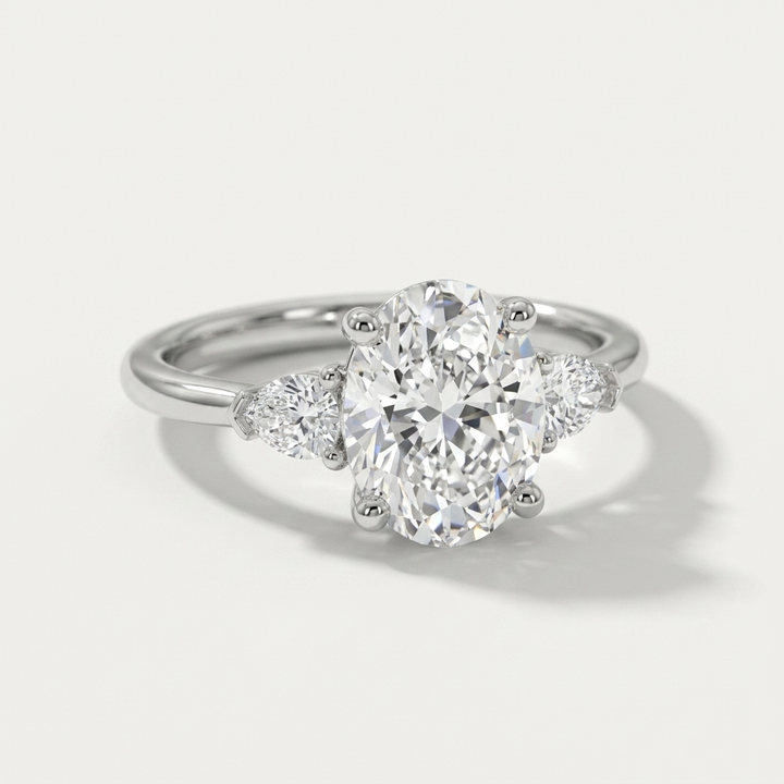 Oval and pear three stone engagement ring, detail view
