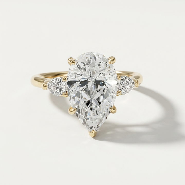 Pear diamond engagement ring with matching pear shape side stones
