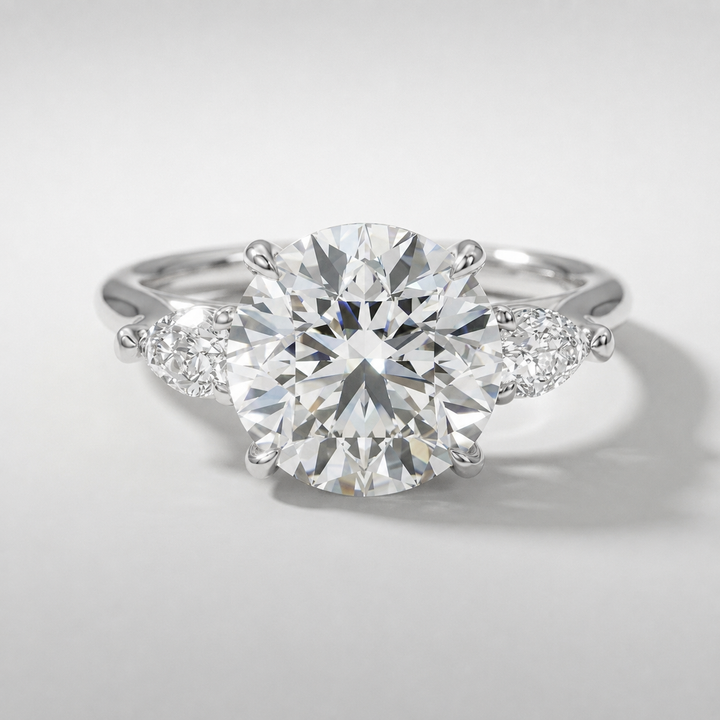 Round and pear three stone engagement ring, alternate view