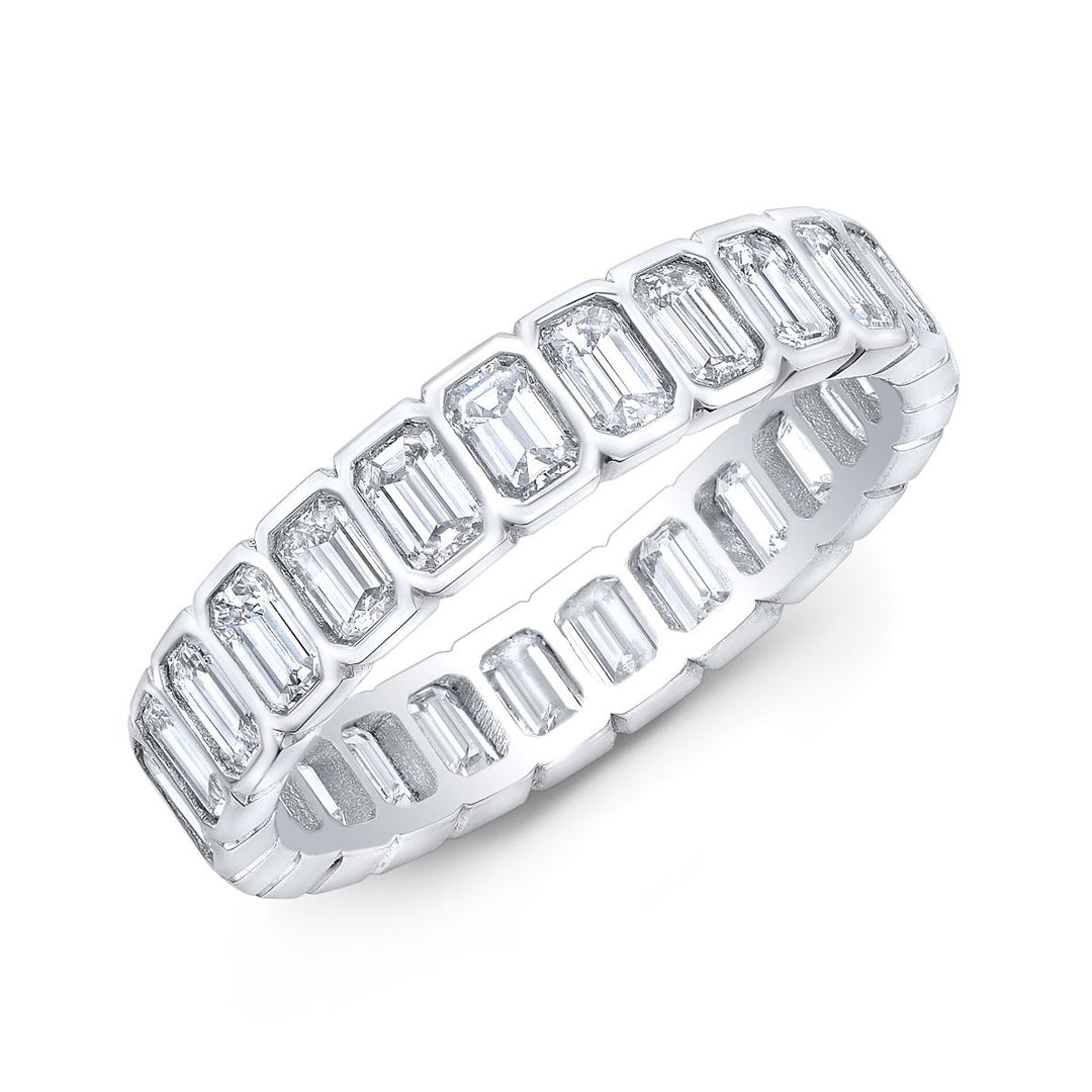Modern eternity band featuring emerald-cut diamonds in a sleek bezel setting, offering a seamless and sophisticated look with timeless elegance.