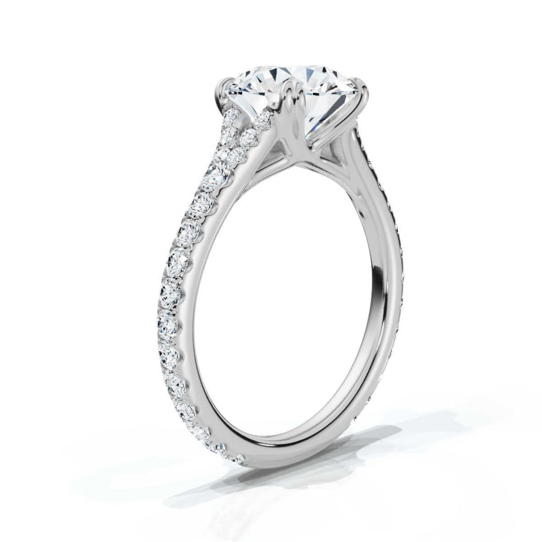 Elegant accented round split ring featuring a brilliant round-cut center diamond, enhanced by sparkling accent stones and a gracefully split band for a sophisticated look.