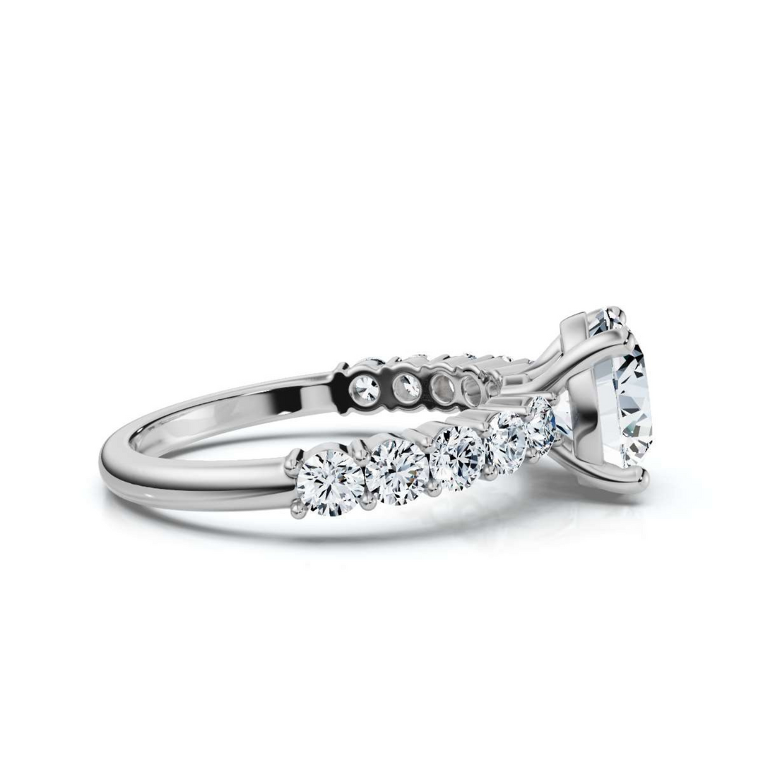 Sophisticated accented round shared prong ring featuring a brilliant round-cut center diamond, complemented by shimmering accent stones in a timeless shared prong setting.