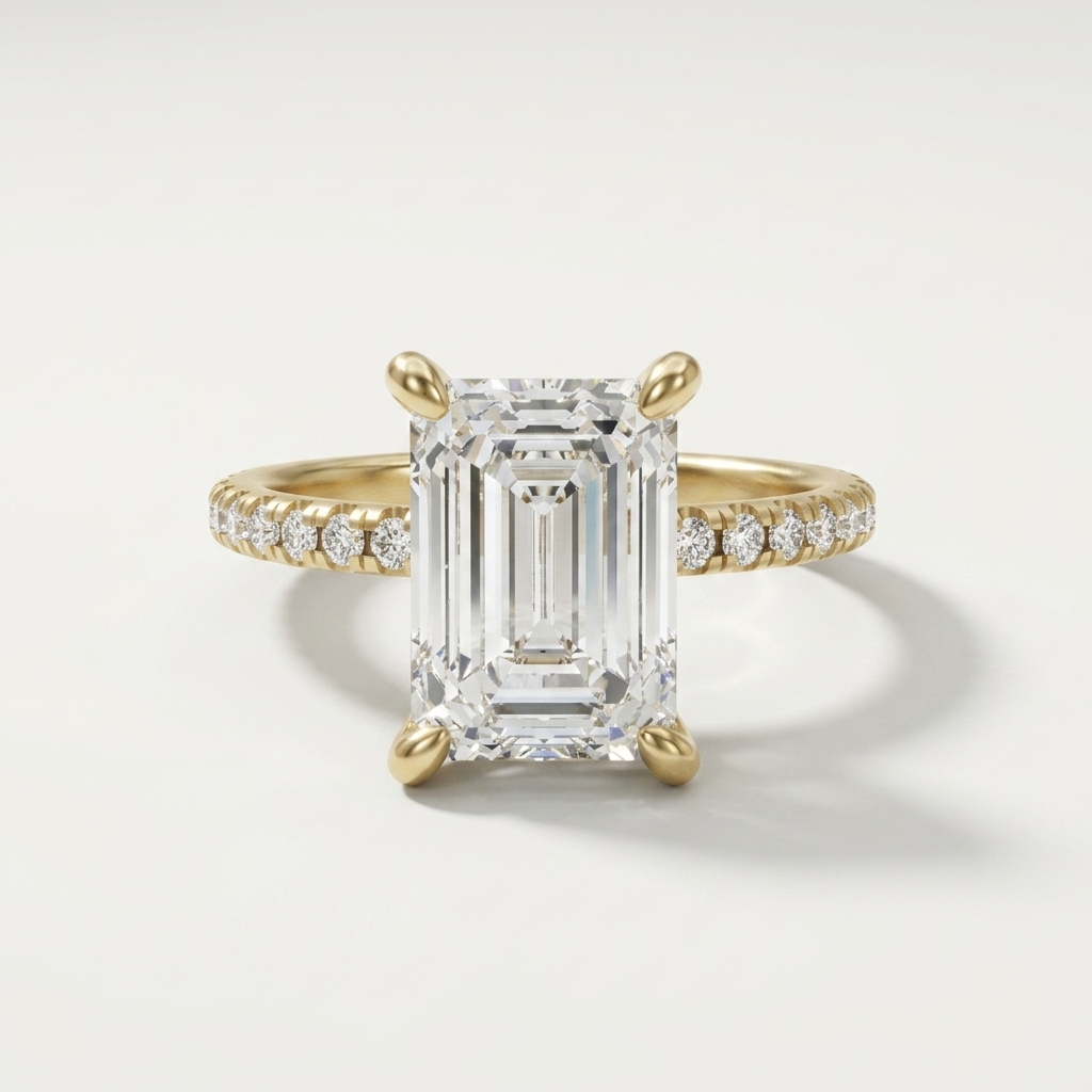 Emerald cut diamond engagement ring on a dainty diamond set band