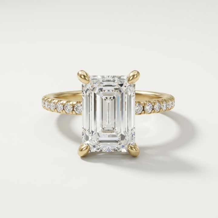 Emerald cut diamond engagement ring on a dainty diamond set band