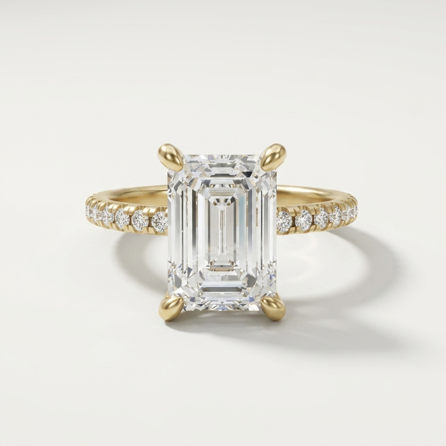 Emerald cut diamond engagement ring on a dainty diamond set band