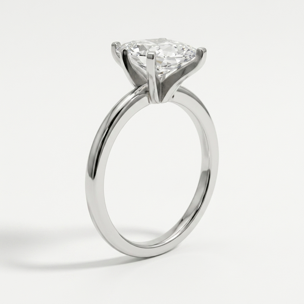 A white gold diamond engagement ring with a round brilliant-cut center stone in a six-prong setting, shown on a clean white background.