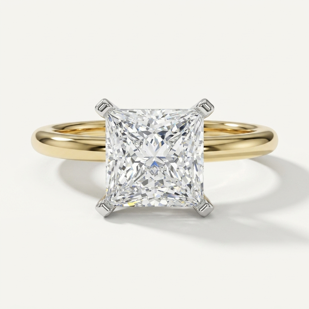 Princess cut diamond solitaire engagement ring on a petite yellow gold band