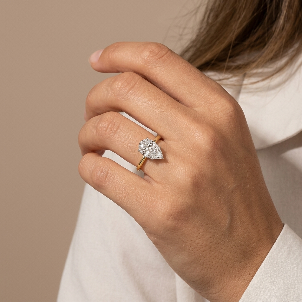 Pear shaped diamond solitaire engagement ring, detail view