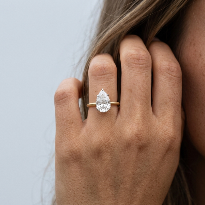 Pear shaped diamond solitaire engagement ring, additional view
