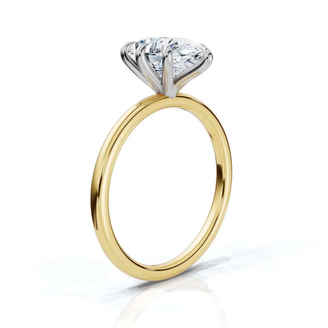 Timeless classic pear solitaire diamond ring, featuring a stunning pear-shaped center diamond set in a sleek four-prong setting, offering an elegant and sophisticated design perfect for engagements or special occasions.