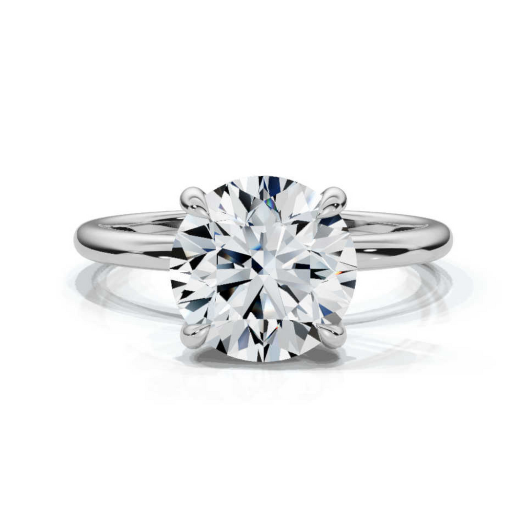 Timeless round solitaire diamond ring, featuring a brilliant round center diamond set in a classic four-prong setting, offering a simple yet elegant design perfect for engagements or special occasions.