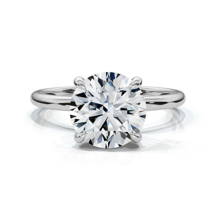 Timeless classic round solitaire ring featuring a brilliant round-cut diamond in a sleek and elegant setting, offering a perfect balance of simplicity and sophistication.