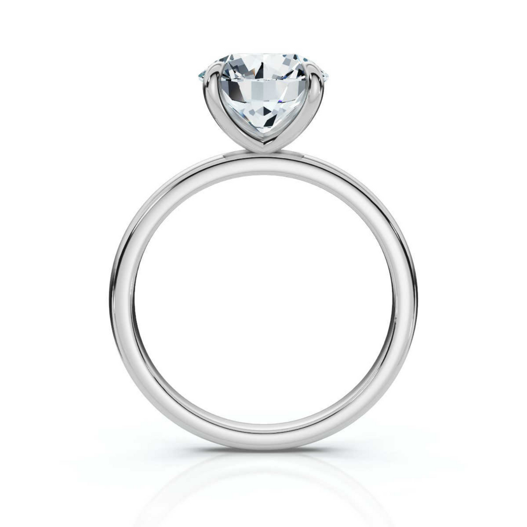 Timeless round solitaire diamond ring, featuring a brilliant round center diamond set in a classic four-prong setting, offering a simple yet elegant design perfect for engagements or special occasions.