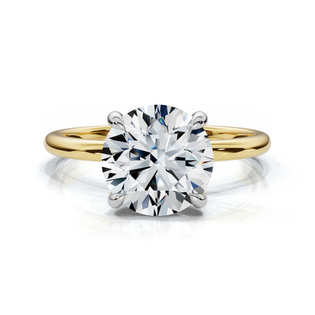 Timeless round solitaire diamond ring, featuring a brilliant round center diamond set in a classic four-prong setting, offering a simple yet elegant design perfect for engagements or special occasions.