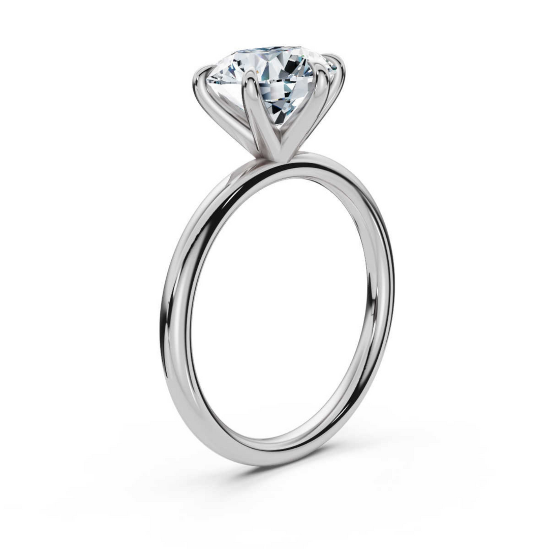 Timeless classic round 6-prong solitaire diamond ring, featuring a brilliant round center diamond securely set in a six-prong setting, offering a sophisticated and elegant design perfect for engagements or special occasions.