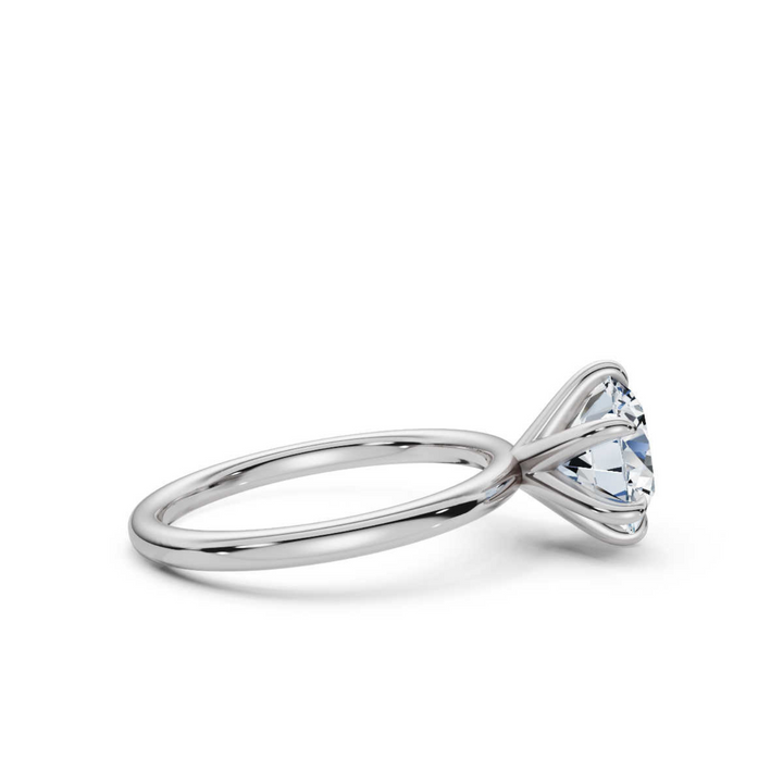 Timeless classic round 6-prong solitaire diamond ring, featuring a brilliant round center diamond securely set in a six-prong setting, offering a sophisticated and elegant design perfect for engagements or special occasions.