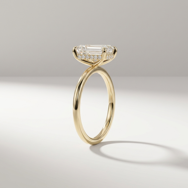 Emerald cut hidden halo solitaire ring, detail view