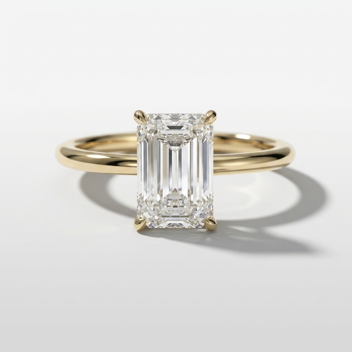 Emerald cut diamond solitaire engagement ring with a hidden halo