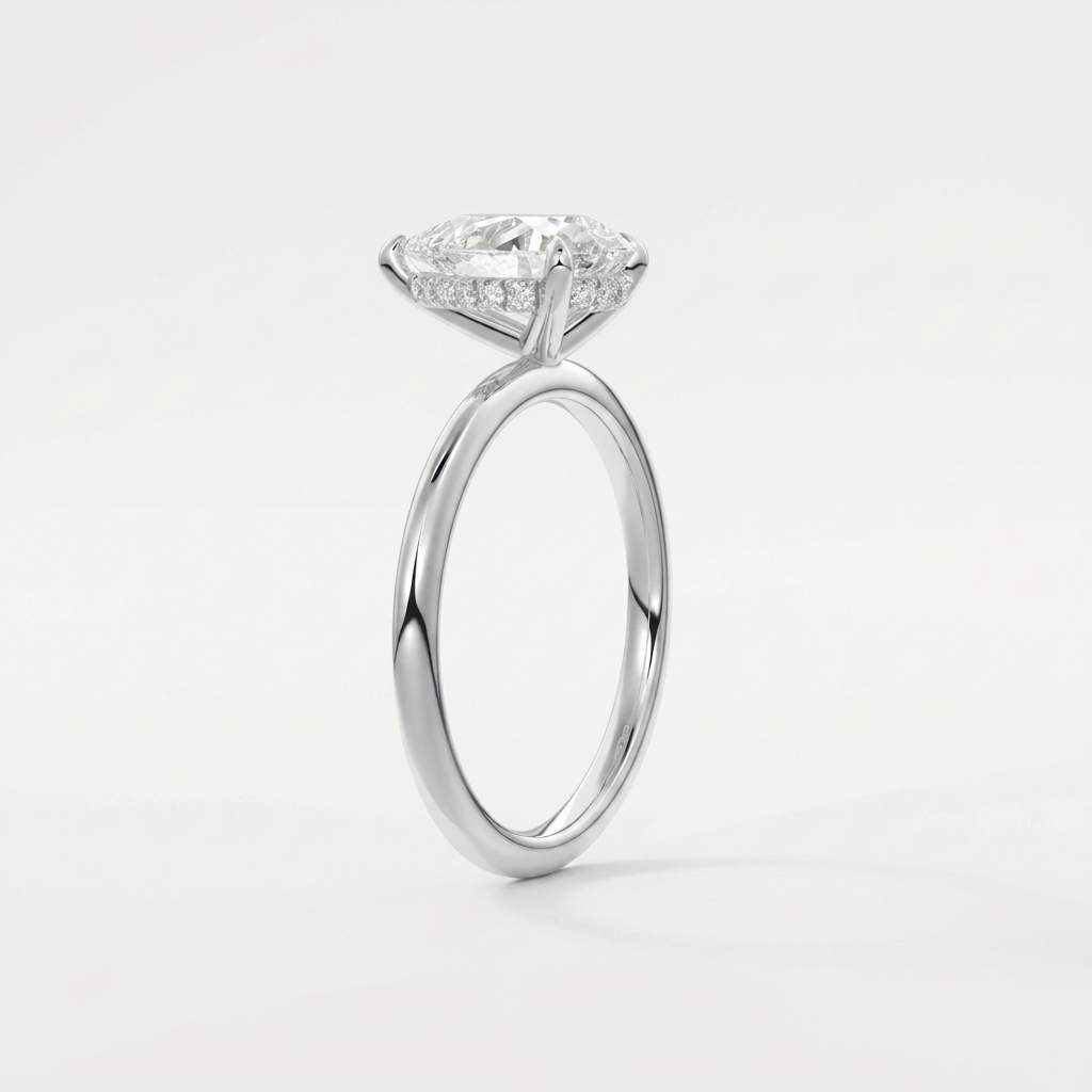Pear hidden halo solitaire engagement ring, detail view