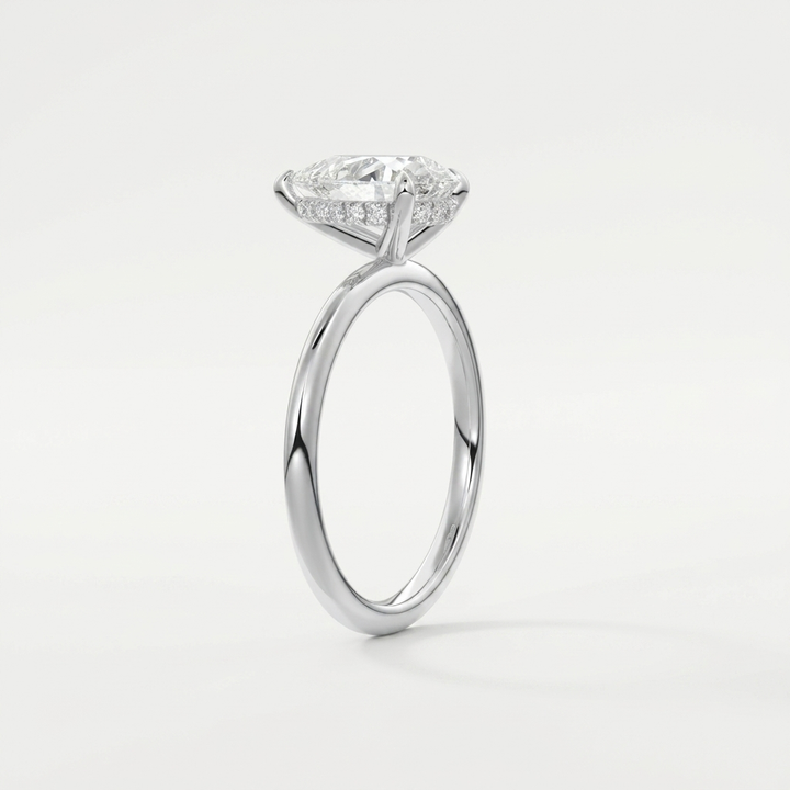 Pear hidden halo solitaire engagement ring, detail view
