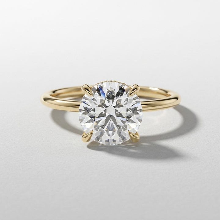 Round diamond solitaire engagement ring with a hidden halo