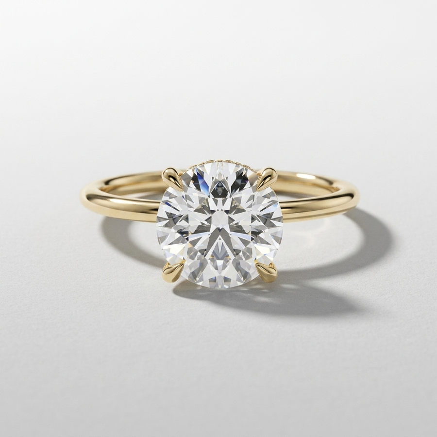 Round diamond solitaire engagement ring with a hidden halo