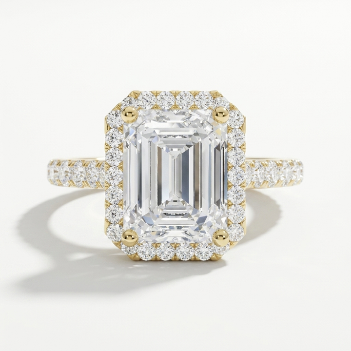 Emerald cut diamond halo engagement ring with a diamond accented band