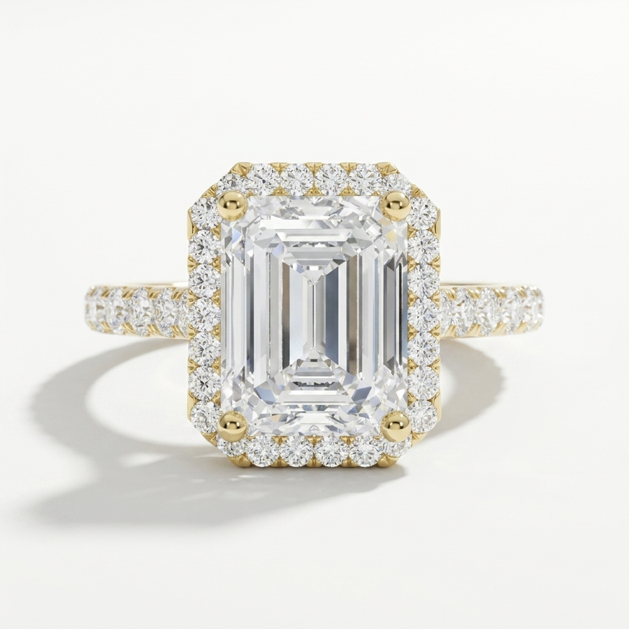Emerald cut diamond halo engagement ring with a diamond accented band