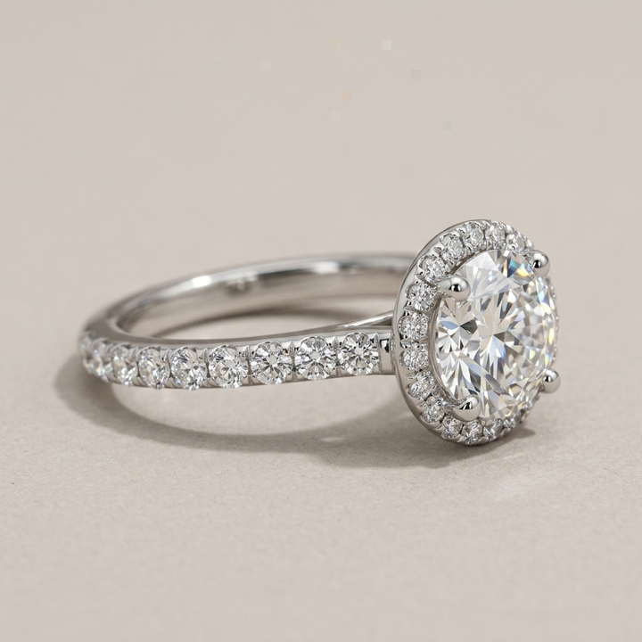 Round diamond halo engagement ring, close-up view