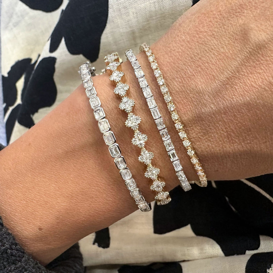 Stunning diamond cluster bangle featuring brilliant diamonds arranged in a radiant cluster design, set in a sleek and elegant bangle for timeless sparkle.