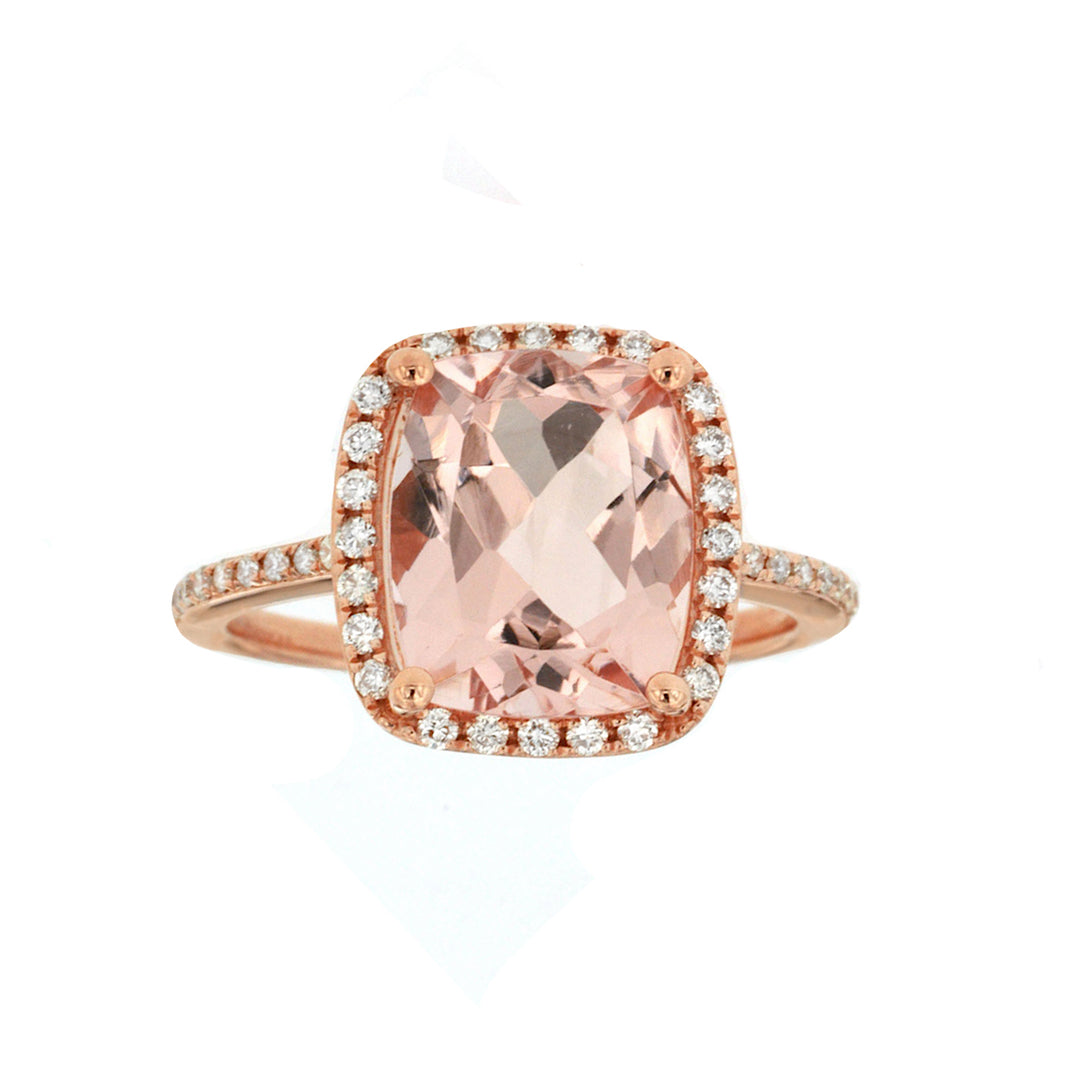 Romantic morganite and diamond halo ring featuring a soft pink morganite center stone surrounded by a shimmering diamond halo for an elegant and timeless look.