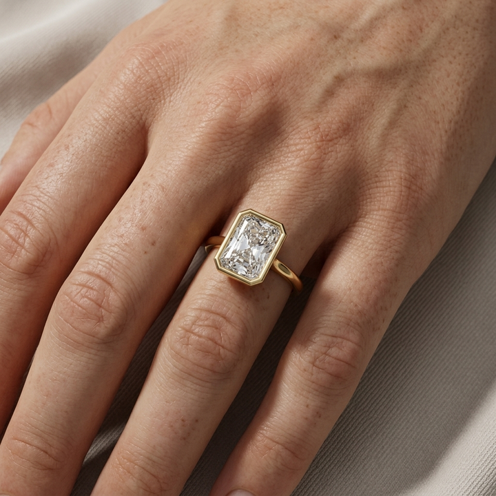 Bezel set radiant diamond solitaire ring, close-up view