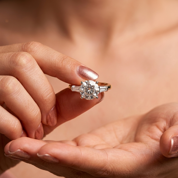 Round and baguette three stone engagement ring, detail view