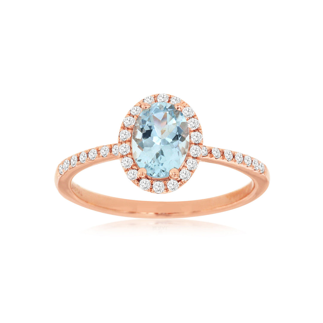 Elegant aquamarine and diamond halo ring featuring a serene blue aquamarine center stone encircled by a sparkling diamond halo for a timeless and sophisticated look.