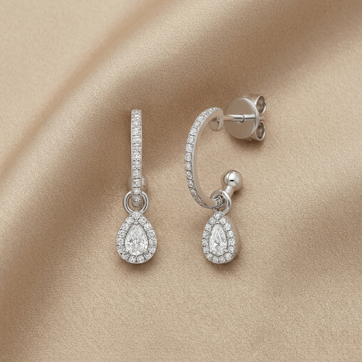 Elegant pear-shaped diamond drop earrings, for a sophisticated and eye-catching look