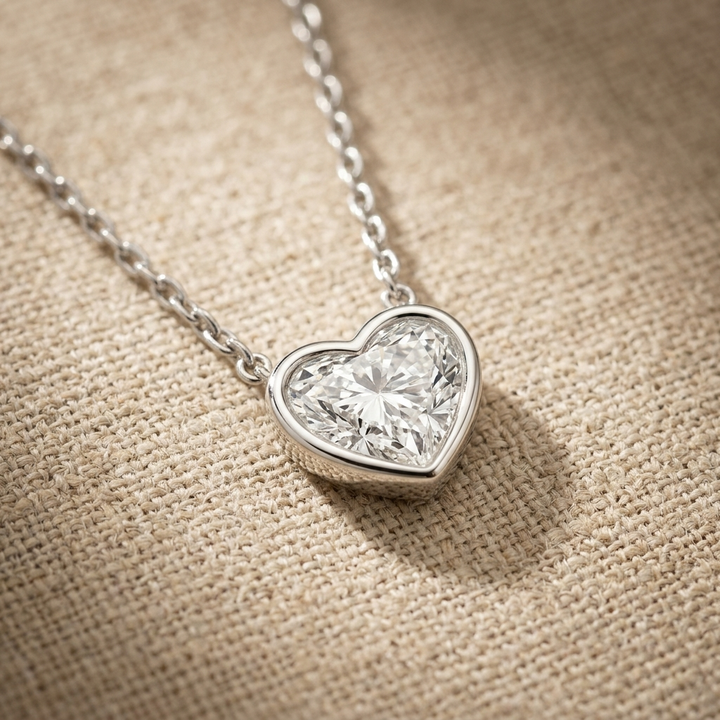 Beautiful heart-shaped lab grown diamond bezel-set necklace, adding radiant sparkle to any occasion