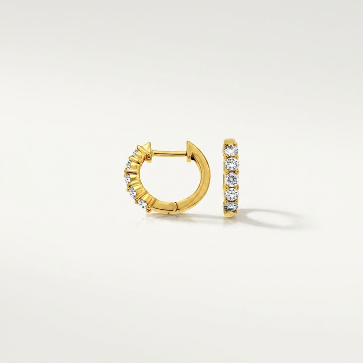 Chic diamond hoop earrings in yellow gold, combining classic style with brilliant sparkle