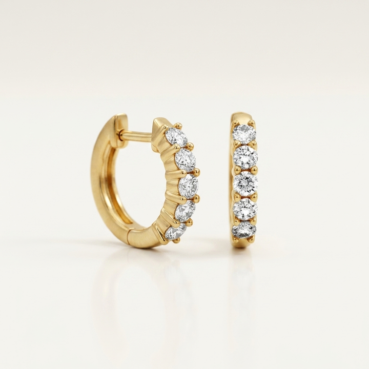 Chic diamond hoop earrings in yellow gold, combining classic style with brilliant sparkle