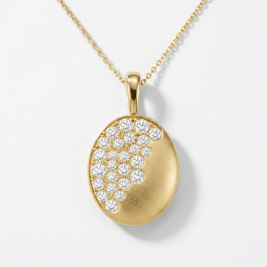Beautiful oval-cut diamond burnish-set necklace in yellow gold, adding radiant sparkle to any occasion