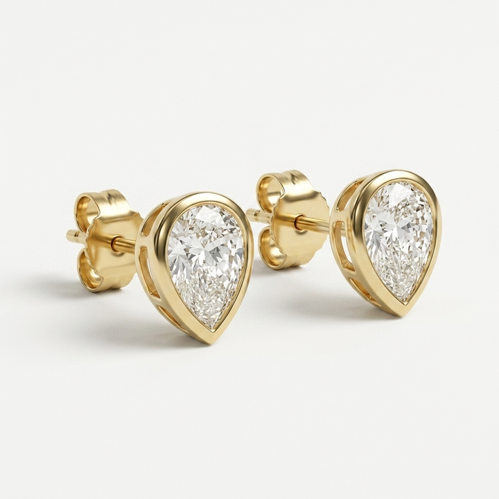Classic 2.00ctw pear-shaped lab grown diamond bezel-set stud earrings, a timeless classic for everyday elegance