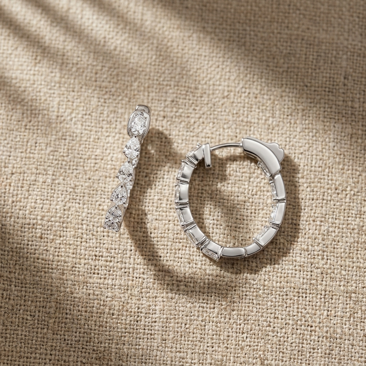 Chic 2.00ctw pear-shaped diamond elongated hoop earrings, combining classic style with brilliant sparkle