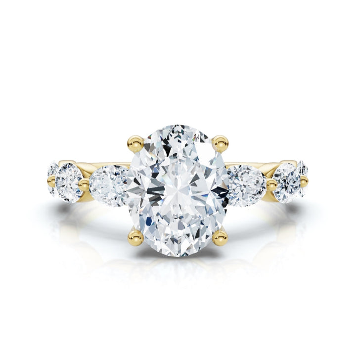 Diamond ring with gold setting on a white background