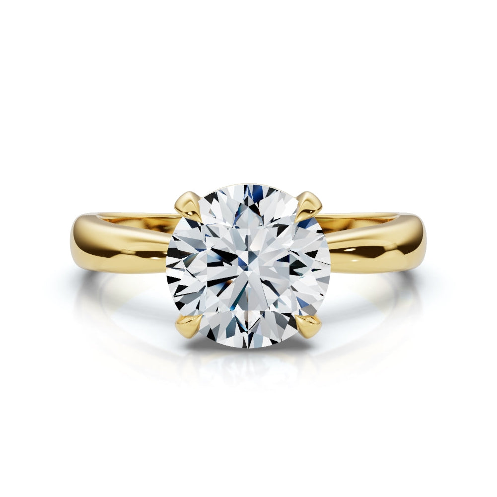 Gold ring with a large diamond on a white background