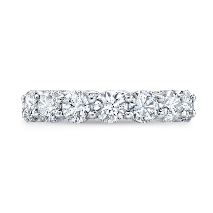 Timeless eternity band featuring round-cut diamonds in a shared prong setting, offering continuous brilliance and classic elegance.