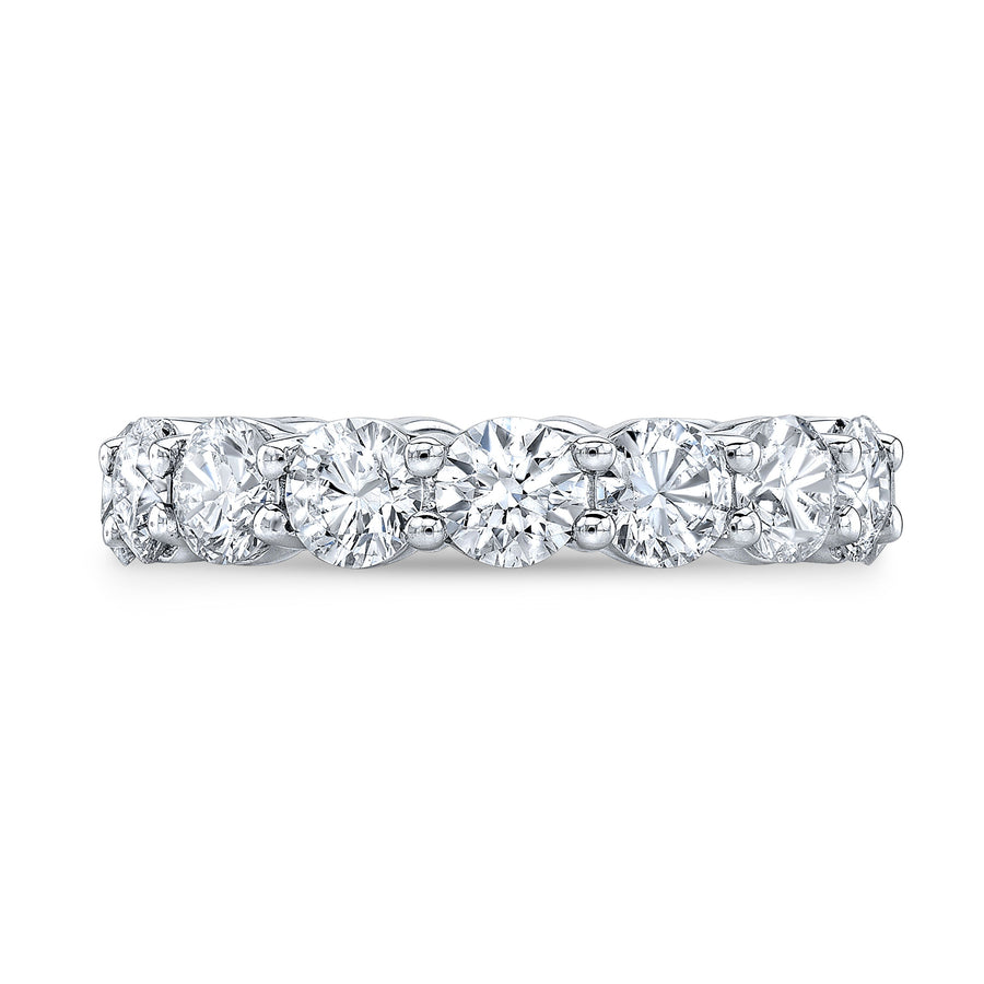 Timeless eternity band featuring round-cut diamonds in a shared prong setting, offering continuous brilliance and classic elegance.